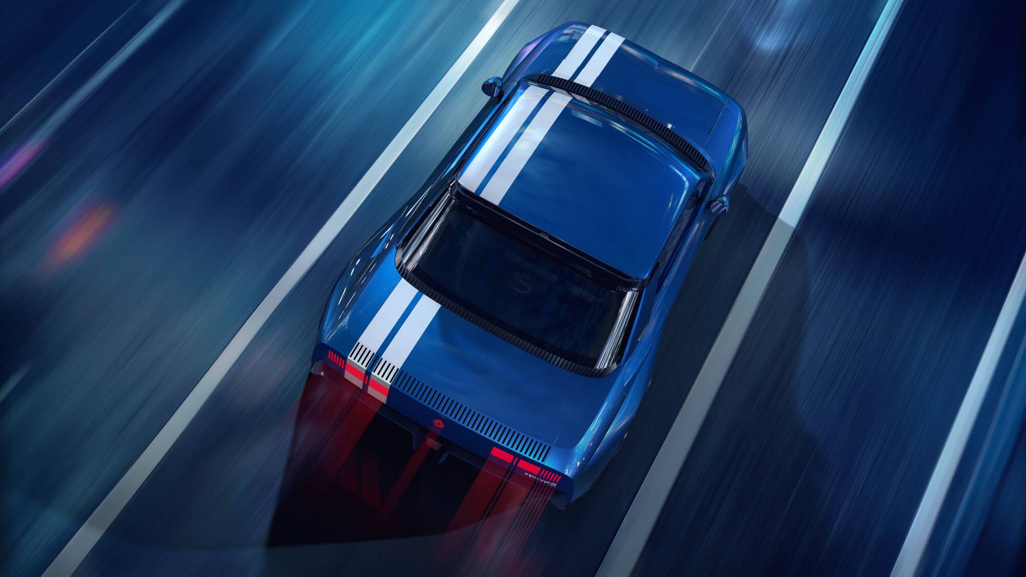 El Renault 8 Gordini Concept azul, con franjas blancas, en una calle de noche